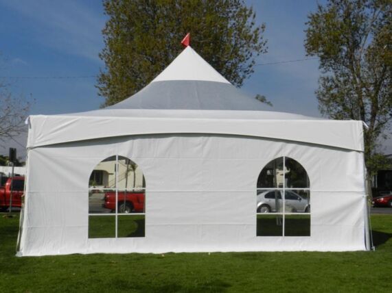 a cathedral window wall with two windows affixed to the side of a marquee event tent