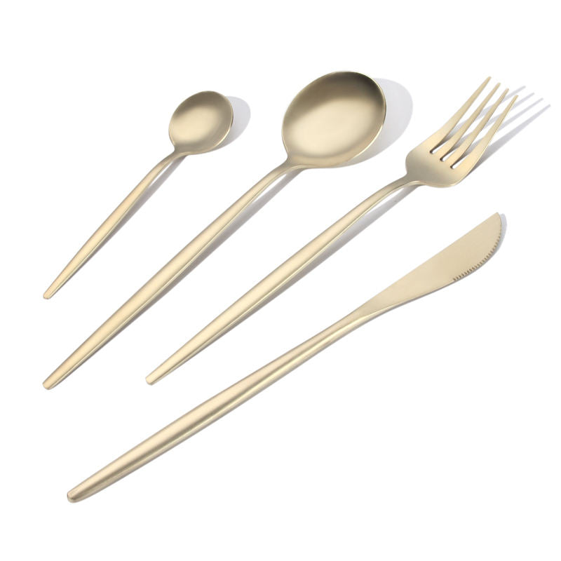 round-handled champagne-coloured cutlery set including tea spoon, dinner spoon, dinner fork, dinner knife