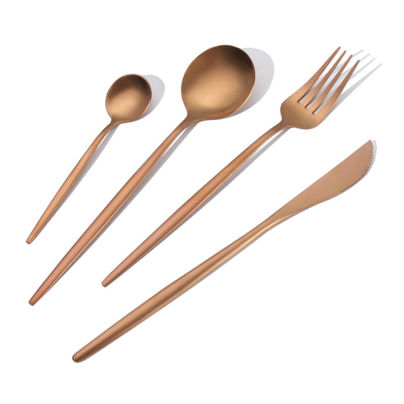 round-handled rose gold cutlery set including tea spoon, dinner spoon, dinner fork, dinner knife